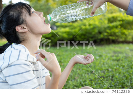 Asian girl patient with weakness,female people suffers from muscular weak or cervical spine osteoarthritis,nerve compression,causes her hands,arms pain,weakening hands or limbs,loss of control of body 74112226