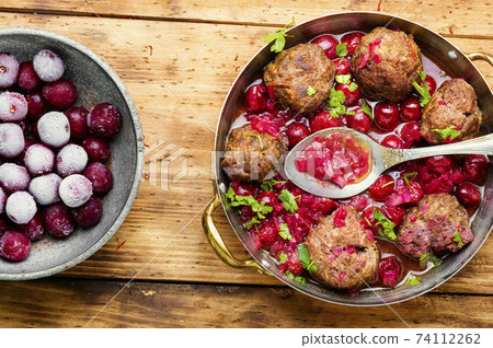 Lamb meatballs in cherry sauce Lamb meatballs in cherry sauce 74112262