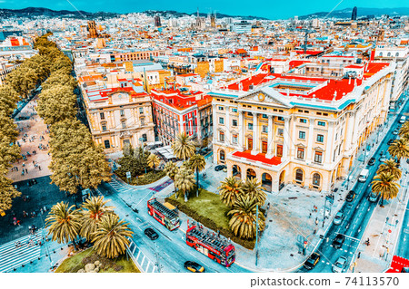 BARCELONA, SPAIN - SEPTEMBER 03: View of the greatest street Rambla in Barcelona a in September 03, 2014 in Barcelona, Catallonia, Spain. The most popular place to walk for tourists. Panorama on BARCELONA, SPAIN - SEPTEMBER 03: View of the greatest street Rambla in Barcelona a in September 03, 2014 in Barcelona, Catallonia, Spain. The most popular place to walk for tourists. Panorama on 74113570