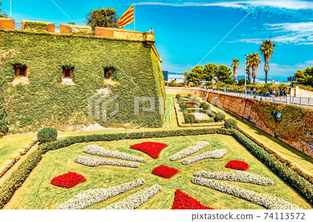 View of Castillo de Montjuic on mountain Montjuic in Barcelona, Spain. View of Castillo de Montjuic on mountain Montjuic in Barcelona, Spain. 74113572