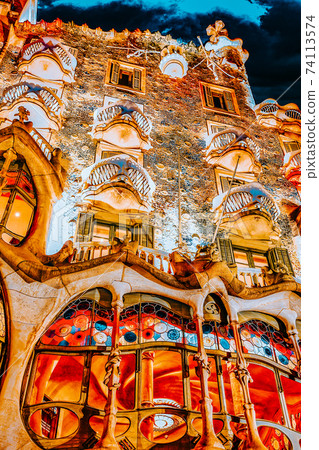 BARCELONA, SPAIN - SEPT  04, 2014: Night outdoor view  Gaudi's  creation-house Casa Batlo. The building that is now Casa Batllo was built in 1877 by Antoni Gaudi, and now commissioned by Lluis Sala 74113574