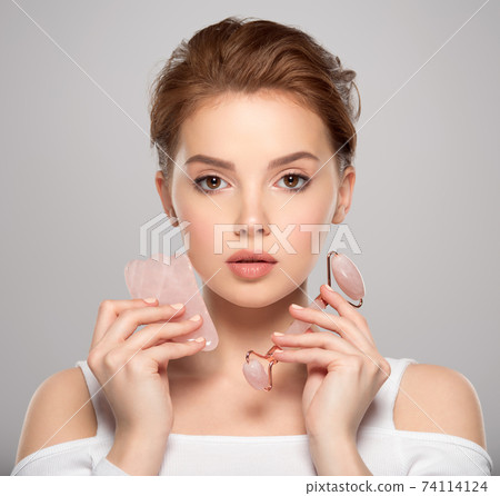 Beautiful face of young caucasian woman with perfect healthy skin, isolated. Pretty white model caring of face. Beauty treatment concept. Skin care concept. Beautiful face of young caucasian woman with perfect healthy skin, isolated. Pretty white model caring of face. Beauty treatment concept. Skin care concept. 74114124