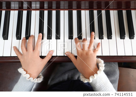 A child's hand playing pineapple A child's hand playing pineapple 74114551