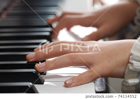 A child's hand playing pineapple A child's hand playing pineapple 74114552