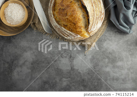 Sourdough rustic bread. Traditional homemade bread, top view, copy space. 74115214