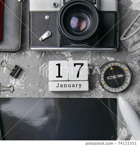 January 17 on the wooden calendar.The seventeenth day of the winter month, a calendar for the workplace. Winter January 17 on the wooden calendar.The seventeenth day of the winter month, a calendar for the workplace. Winter 74115351