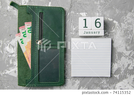 January 16 on the wooden calendar.The sixteenth day of the winter month, a calendar for the workplace. Winter January 16 on the wooden calendar.The sixteenth day of the winter month, a calendar for the workplace. Winter 74115352