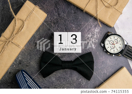 January 13 on the wooden calendar.The thirteenth day of the winter month, a calendar for the workplace. Winter January 13 on the wooden calendar.The thirteenth day of the winter month, a calendar for the workplace. Winter 74115355