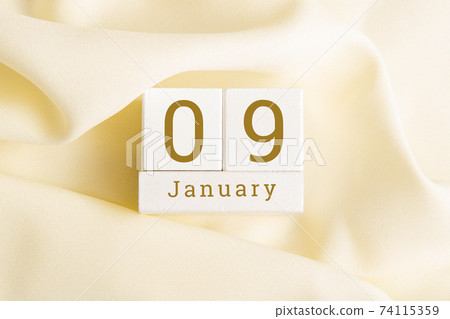 January 9 on the wooden calendar.The ninth day of the winter month, a calendar for the workplace. Winter January 9 on the wooden calendar.The ninth day of the winter month, a calendar for the workplace. Winter 74115359