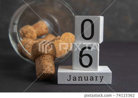 January 6 on the wooden calendar.The sixth day of the winter month, a calendar for the workplace. Winter January 6 on the wooden calendar.The sixth day of the winter month, a calendar for the workplace. Winter 74115362