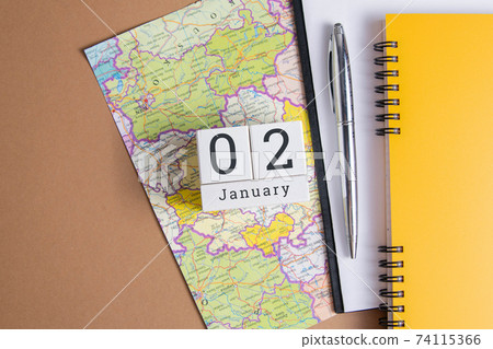 January 2 on the wooden calendar.The second day of the winter month, a calendar for the workplace. Winter January 2 on the wooden calendar.The second day of the winter month, a calendar for the workplace. Winter 74115366