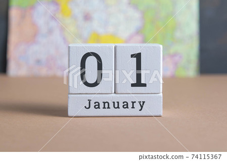 January 1 on the wooden calendar.The first day of the winter month, a calendar for the workplace. Autumn January 1 on the wooden calendar.The first day of the winter month, a calendar for the workplace. Autumn 74115367