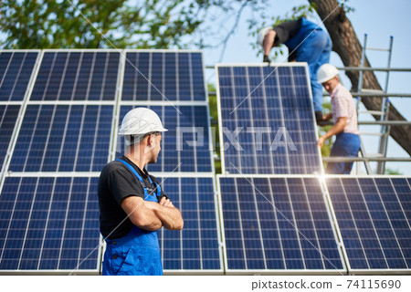Stand-alone exterior solar panel system installation, renewable green energy generation concept. Stand-alone exterior solar panel system installation, renewable green energy generation concept. 74115690