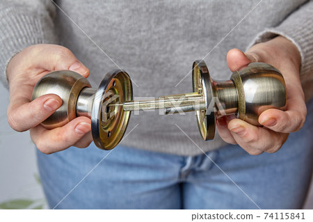 Two pieces of door knob with shutter before installation. Two pieces of door knob with shutter before installation. 74115841