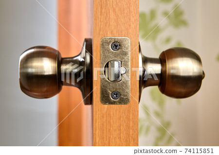 Brass door knob with latch and lock. 74115851