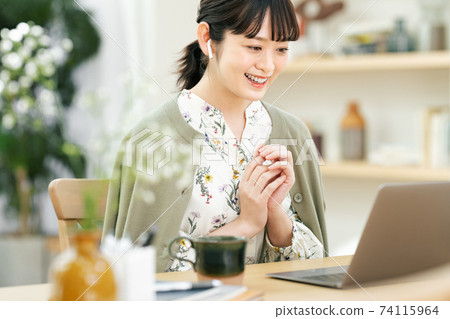 Young woman making a video call at home 74115964