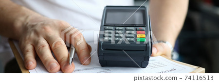 Person holding silver pen Person holding silver pen 74116513