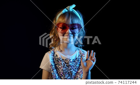Futuristic hipster teen girl waving hand, hello, hi, welcome, bye, greetings at disco cyberpunk club 74117244