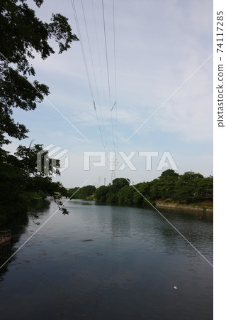 Toiwa Canal and transmission line tower in early summer 74117285