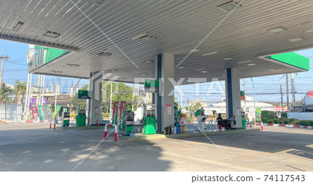 Chiangmai, Thailand-February 2, 2021 : PT major oil service station in Thailand, Fueling and gas locations for motorbikes and cars, Engine resting stations for long-distance vehicles, Oil station. 74117543