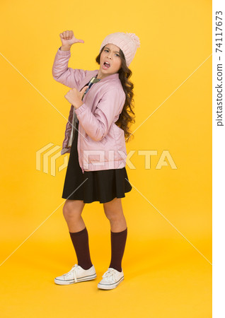 Self confidence concept. Happy child yellow background. 74117673