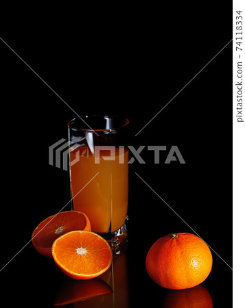 Orange juice in a clear glass. Orange juice in a clear glass. 74118334