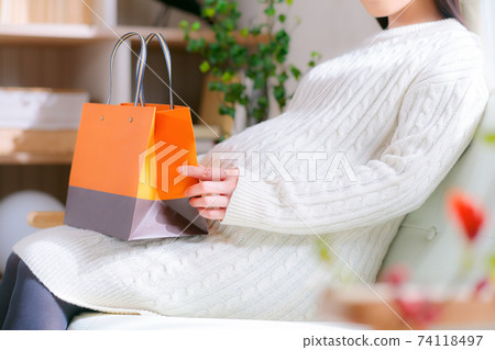 Pregnant woman with a paper bag Pregnant woman with a paper bag 74118497