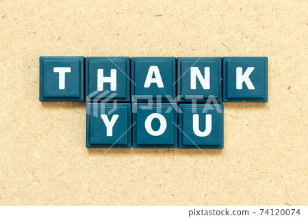 Tile alphabet letter in word thank you on wood background Tile alphabet letter in word thank you on wood background 74120074