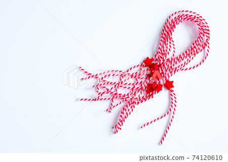 Holiday Bulgarian Martenitsa braslets on white background 74120610