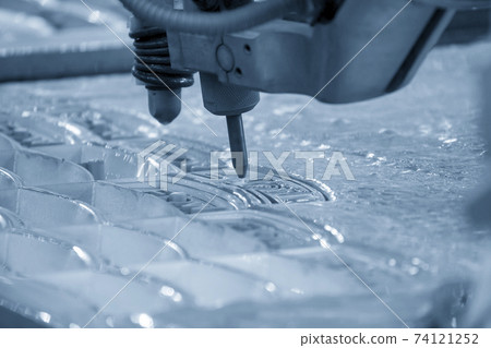 The abrasive water jet machine cutting the metal plate. The abrasive water jet machine cutting the metal plate. 74121252