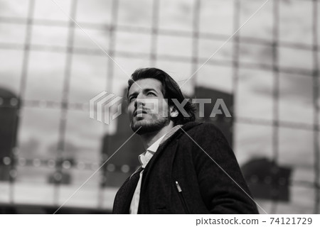 Portrait of an handsome businessman in the city. Portrait of an handsome businessman in the city. 74121729