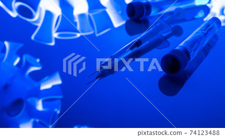 Virus protection. Medical syringe with needle for protection flu virus and coronavirus. Covid vaccine isolated on blue. Syringe, medical injection. 74123488