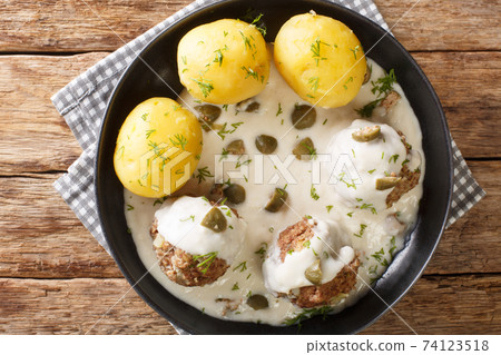 German Meatballs in Gravy with capers Konigsberger Klopse close-up in a plate. Horizontal top view 74123518