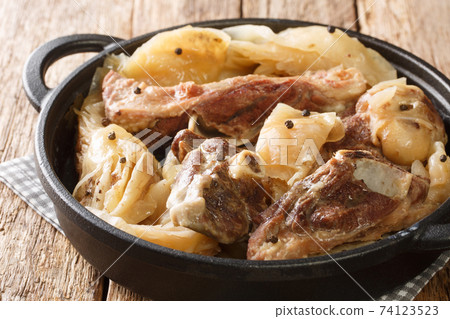 lamb and cabbage or known as farikal is Norway's national dish close-up in a pan. Horizontal lamb and cabbage or known as farikal is Norway's national dish close-up in a pan. Horizontal 74123523