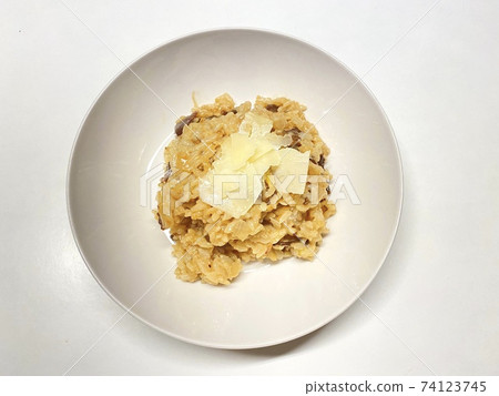 Homemade mushroom risotto on a white plate Homemade mushroom risotto on a white plate 74123745