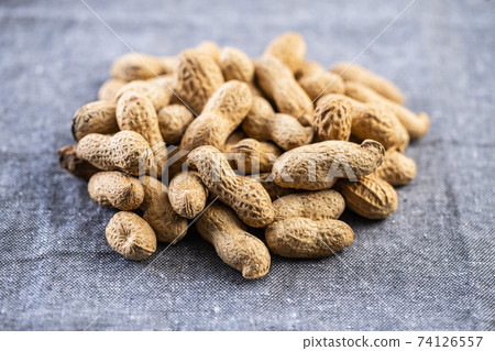 Roasted peanuts. Tasty groundnuts. 74126557