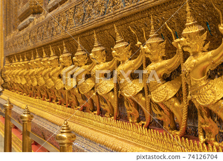 Garuda statue at Golden pagoda at Temple of the Emerald Buddha in Bangkok, Thailand. Wat Phra Kaew and Grand palace in old town, urban city. Buddhist temple, Thai architecture. 74126704