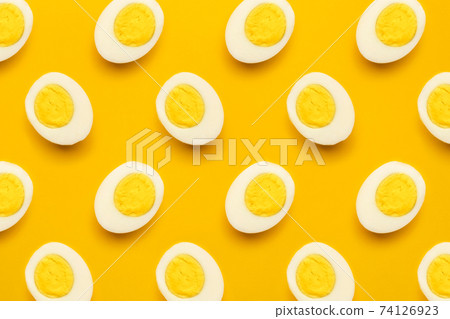 Boiled eggs pattern on yellow background 74126923