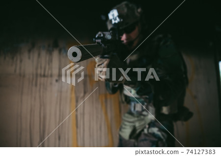Soldier in combat. Urban combat training, soldier entering abandoned building. Anti terrorist operation battlefield training. 74127383