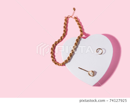 Fashion valentine backgound with golden accessories on white heart shape podium Fashion valentine backgound with golden accessories on white heart shape podium 74127925
