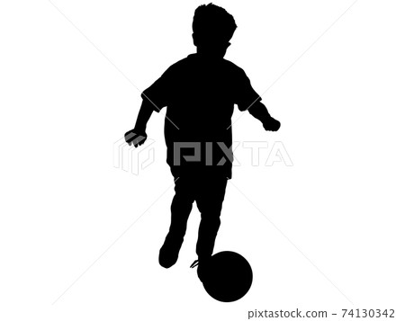 Silhouette of a boy dribbling 74130342