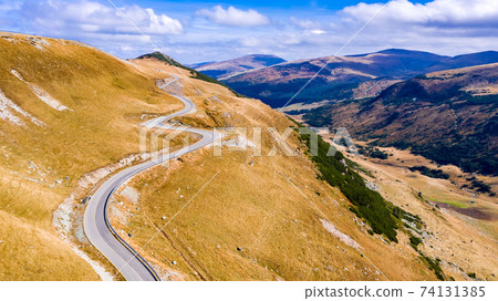 Transalpina, Romania - Carpathian Mountains winding road. 74131385