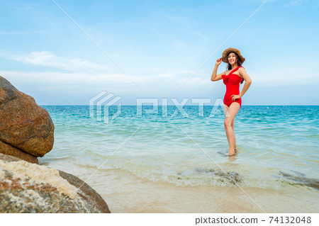 happy woman in sea beach at Koh MunNork Island, Rayong, Thailand happy woman in sea beach at Koh MunNork Island, Rayong, Thailand 74132048
