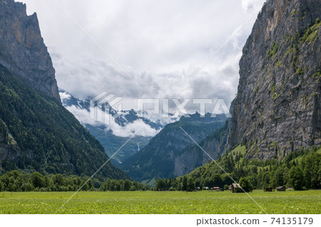 View valley of waterfalls in city Lauterbrunnen, Switzerland, Europe View valley of waterfalls in city Lauterbrunnen, Switzerland, Europe 74135179