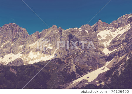 View closeup Alpine mountains in National park Dachstein, Austria, Europe View closeup Alpine mountains in National park Dachstein, Austria, Europe 74136400