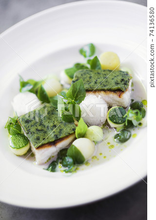 fish fillet with herbs vegetables and citrus cream sauce fish fillet with herbs vegetables and citrus cream sauce 74136580