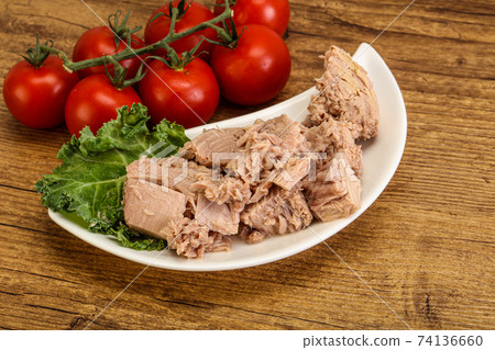 Canned tuna fillet in the bowl Canned tuna fillet in the bowl 74136660