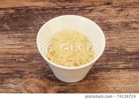 Raw basmati rice in the bowl Raw basmati rice in the bowl 74136724