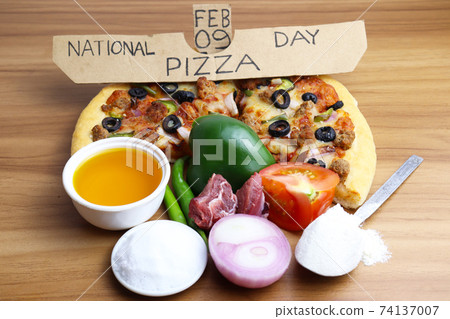 tasty pizza closeup with spice for pizza day 74137007