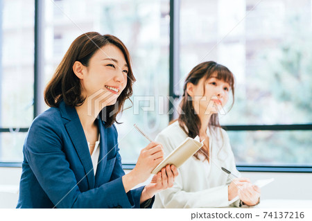 Women taking seminars 74137216